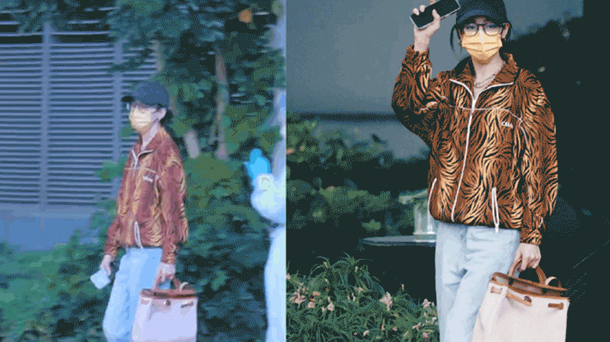 迪丽热巴现身广州机场 和粉丝打招呼蹦蹦跳跳动作可爱